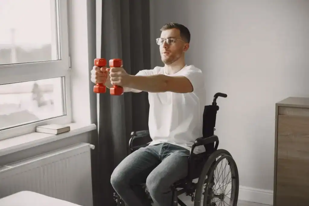 Image of man doing exercise in his wheelchair to aid weight loss Feltham