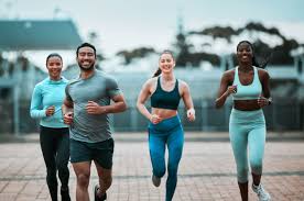 Sculpting Sleek Arms: The Essential Role of Cardio in Toning Without Bulking Up 3 image of people running to incorporate cardio Feltham exercise into their life to help tone arms and body.