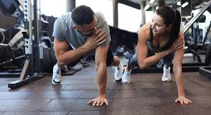 Sculpting Sleek Arms: The Essential Role of Cardio in Toning Without Bulking Up 1 Image of man and woman doing Cardio Feltham to tone their arms.